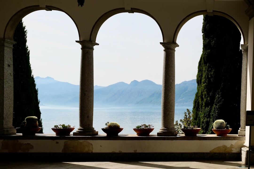 Elegant living room of a luxury villa with grand piano and lake view